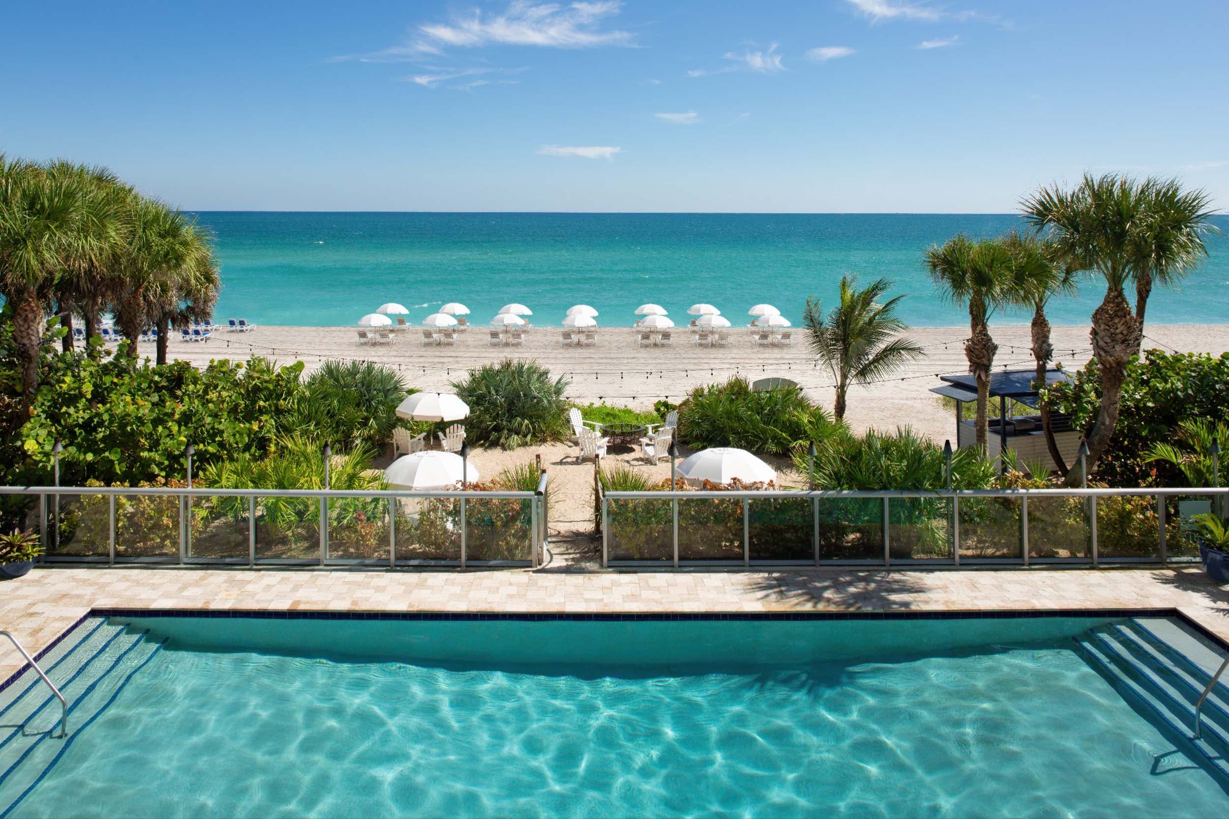 Pool with path to the beach at Solé Miami, Florida