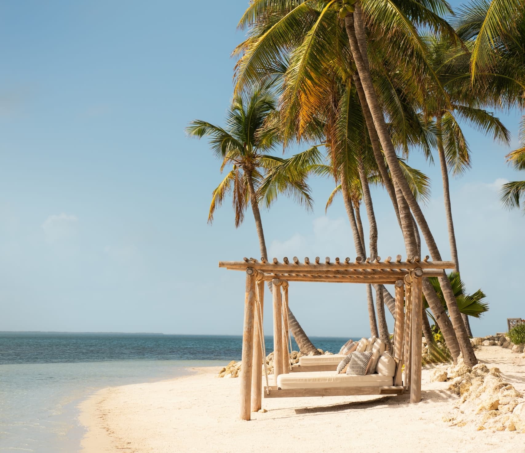 Lounging beds on the beach at Little Palm Island