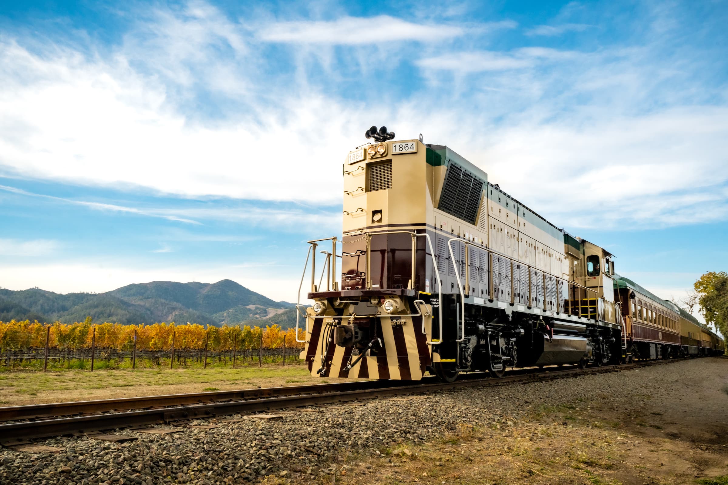 Napa Valley Wine Train on the tracks with grape trees in the background
