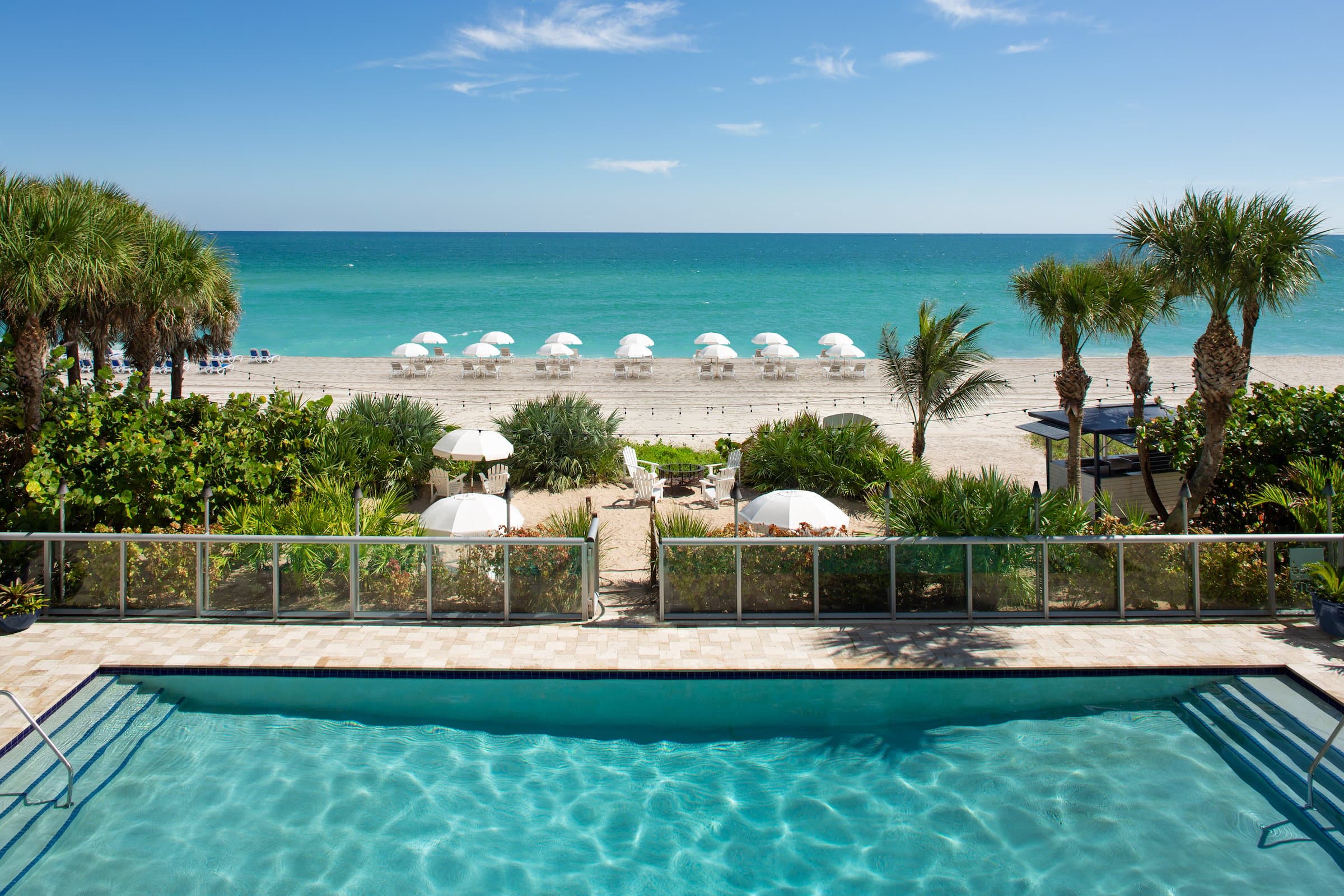 Pool with path to the beach at Solé Miami, Florida
