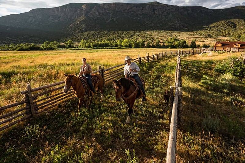 Two cattle ranchers on their horses in Colorado
