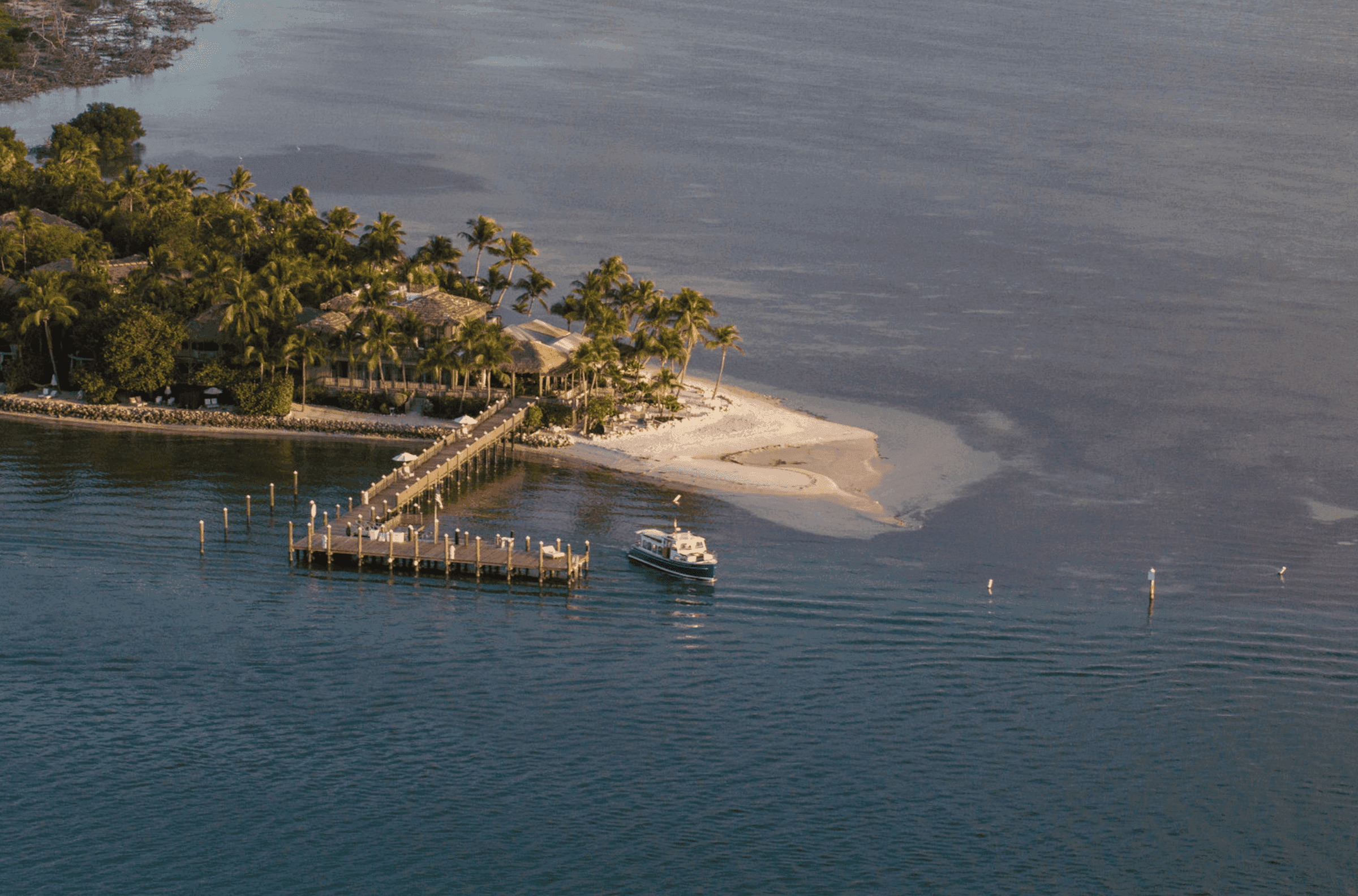 Boat next to the pier at Little Palm Island