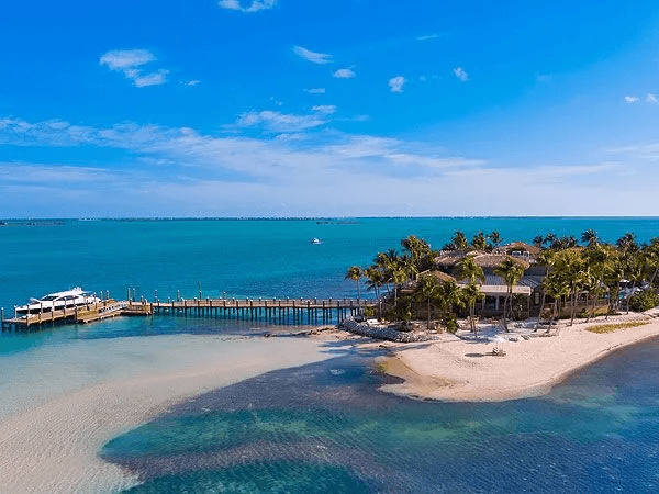 Aerial view of Little Palm Island with a long deck to the island from the marina