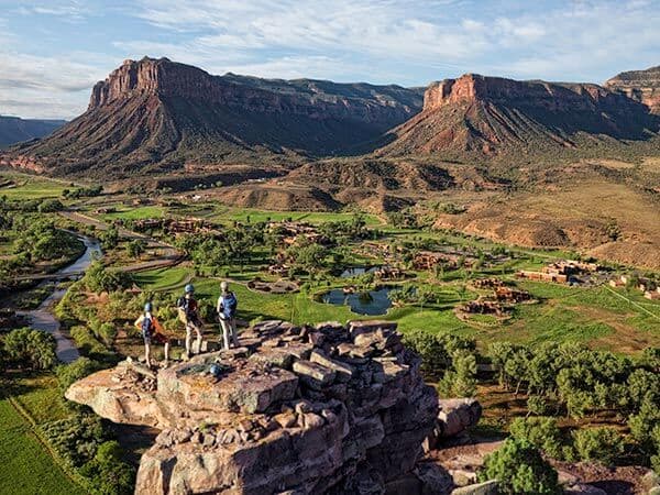 Hikers looking out onto the Gateway Canyons Resort & Spa, Gateway, CO