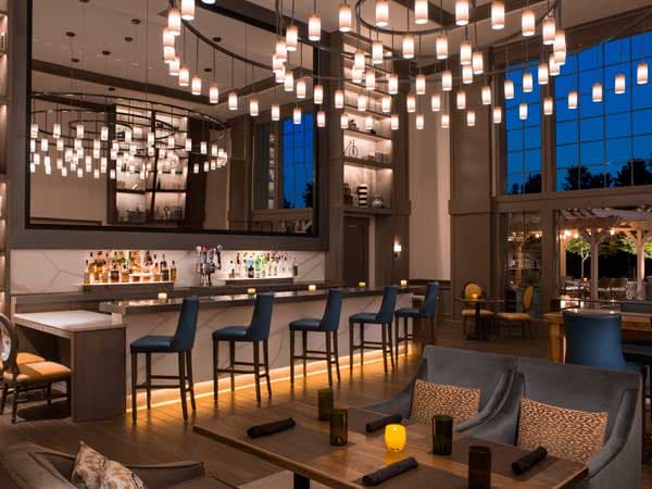 Lobby bar at night at a Noble House Hotels & Resorts property