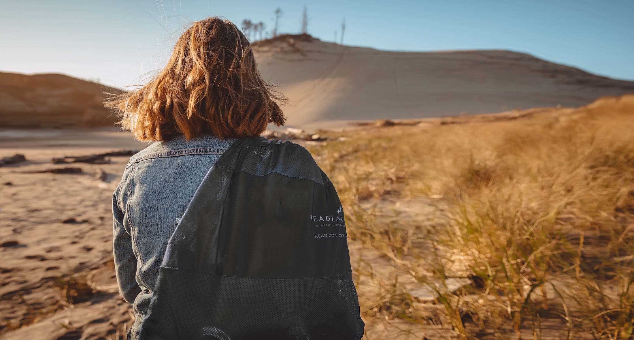 Back of woman in desert like area
