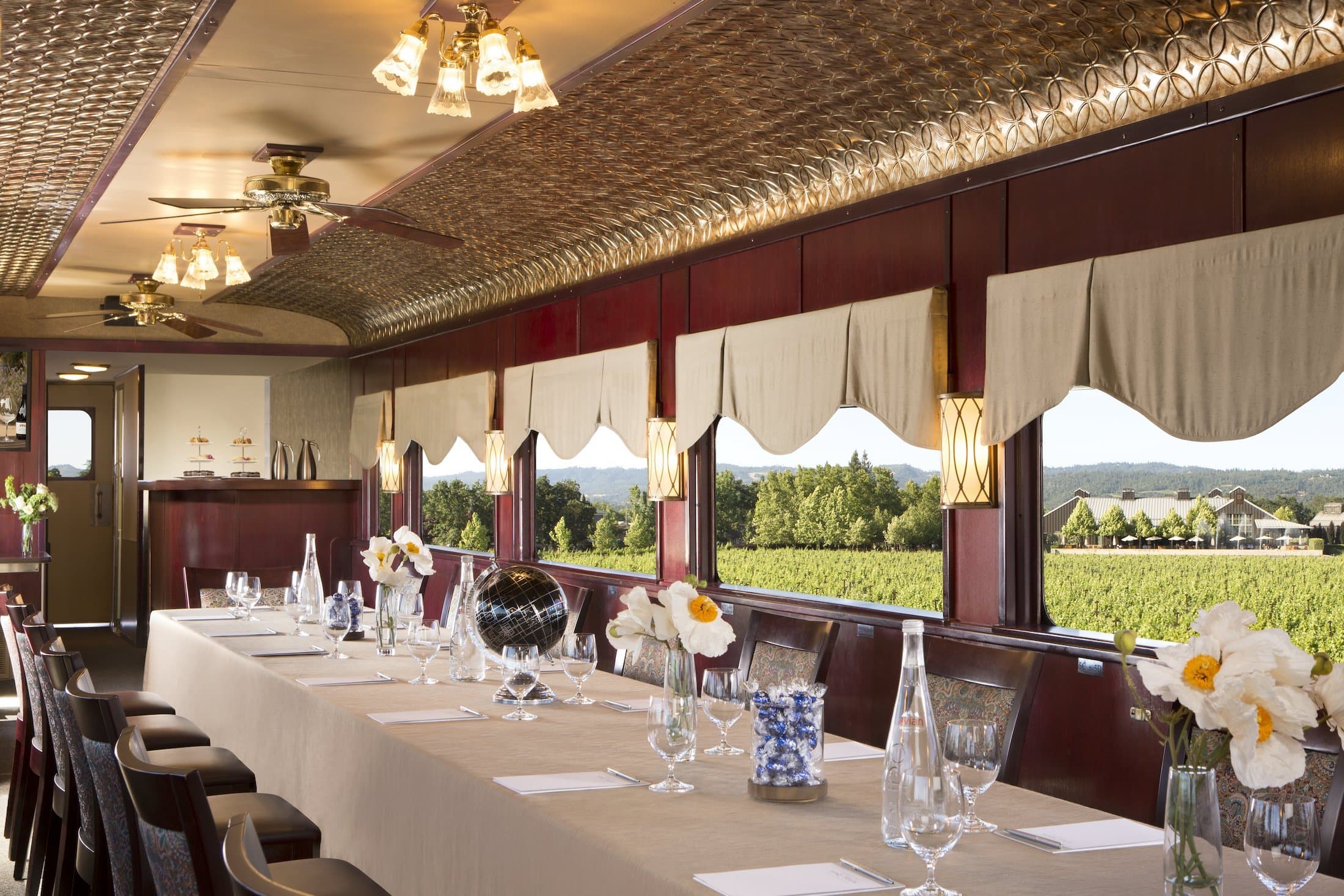 A table beautifully set up for an event in a railcar for Napa Valley Wine Train