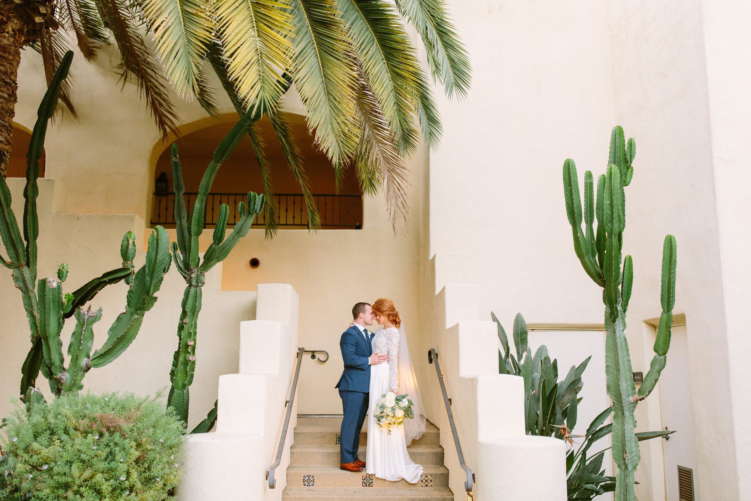 A couple getting wedding photos taken at Estancia La Jolla Hotel & Spa in California